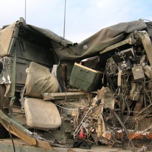 2. Aftermath of a Humvee and civilian dump-truck head-on collision, outside Camp Bucca, in which two soldiers and Iraqi boy were killed.