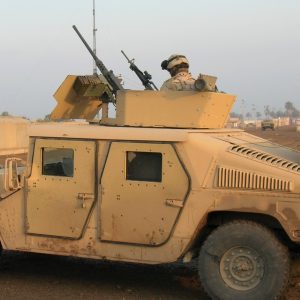 A Humvee with .50-caliber machine gun, at Abu Ghraib prison hospital, preparing to join a convoy.